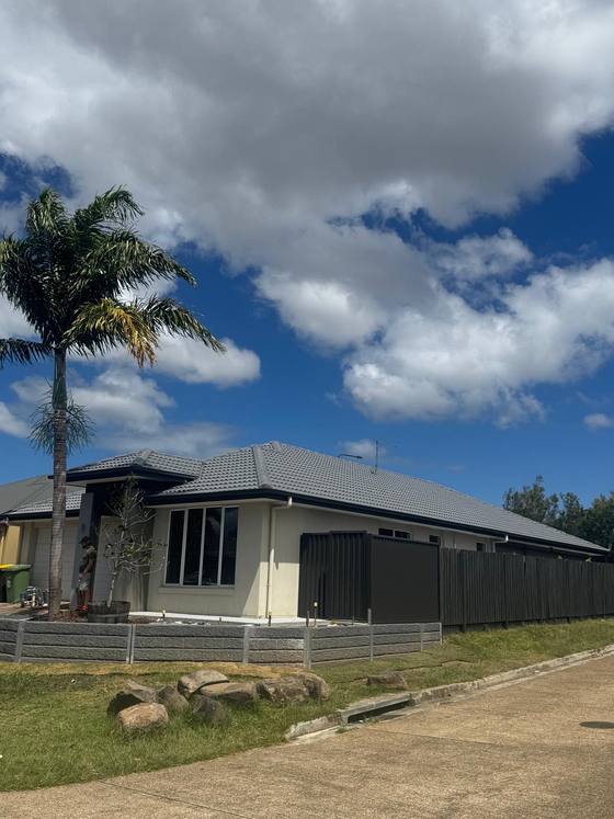 A finished home with a charcoal roof