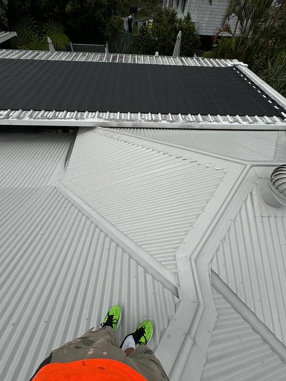 A freshly coated white metal roof