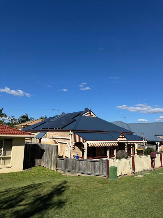 A restored charcoal roof on a brick home